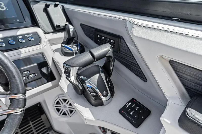 Slide: The Image of 2022 Cobalt R8 Outboard boat cockpit with modern controls and steering wheel. - 19