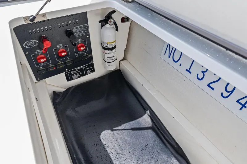 Slide: The Image of Control panel and fire extinguisher in 2022 Cobalt R8 Outboard boat compartment. - 27