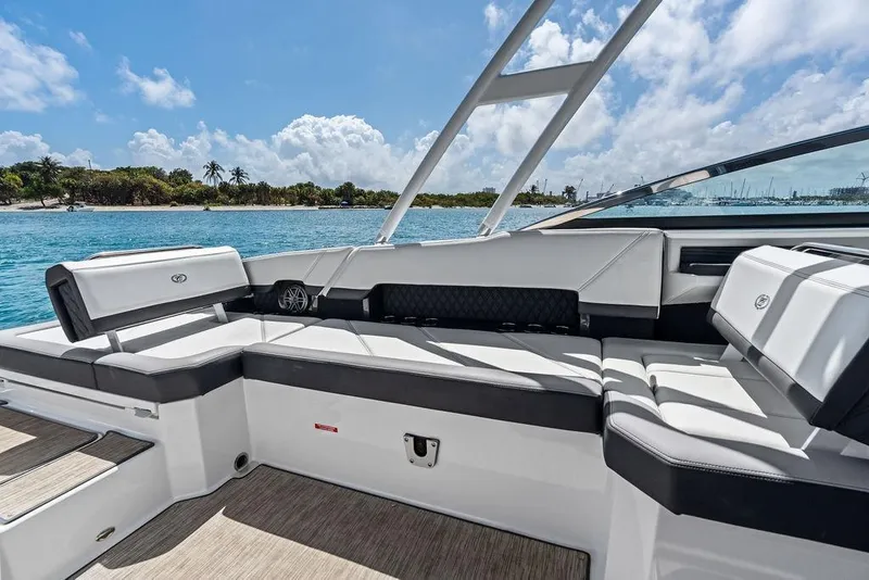 Slide: The Image of 2022 Cobalt R8 Outboard boat interior with luxurious seating, ocean view, and clear skies. - 29