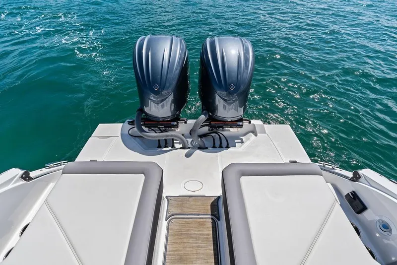 Slide: The Image of 2022 Cobalt R8 Outboard boat with dual engines on open water. - 31