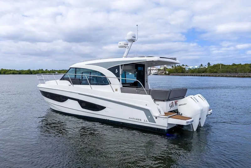 Slide: The Image of 2022 Beneteau Antares 11 boat on calm water, side view. - 10