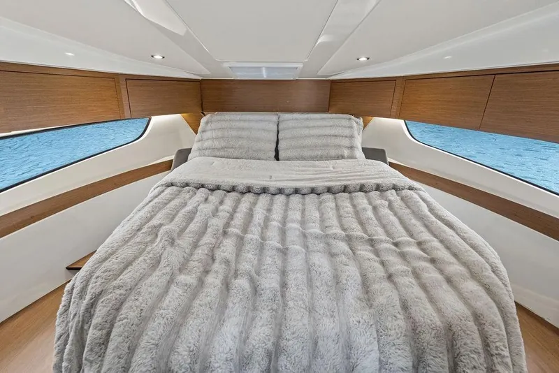 Slide: The Image of Luxurious cabin interior of 2022 Beneteau Antares 11 with cozy bedding. - 11