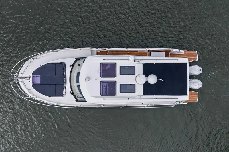 Slide: The Image of Top view of a 2022 Beneteau Antares 11 boat on water. - 30