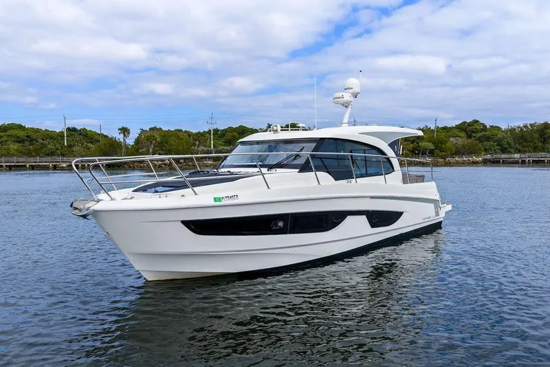 Slide: The Image of 2022 Beneteau Antares 11 yacht on calm water, showcasing sleek design and modern features. - 9