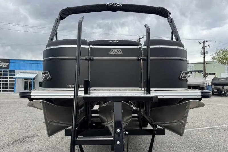Slide: The Image of 2026 Avalon 2385 25 Catalina QL pontoon boat, rear view, parked outdoors. - 4