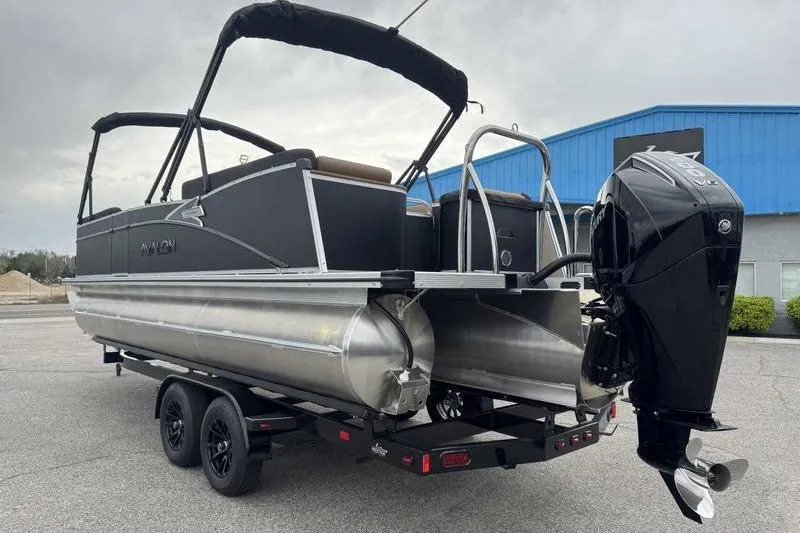 Slide: The Image of 2026 Avalon 2385 25 Catalina QL pontoon boat on trailer, featuring sleek design and powerful outboard motor. - 5