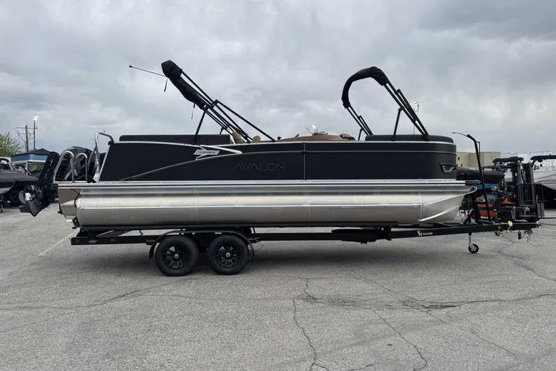 Slide: The Image of 2026 Avalon 2385 25 Catalina QL pontoon boat on trailer, overcast sky background. - 6
