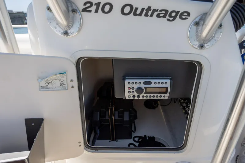 Slide: The Image of Boston Whaler 210 Outrage 2006 console with electronic equipment and storage compartment. - 28