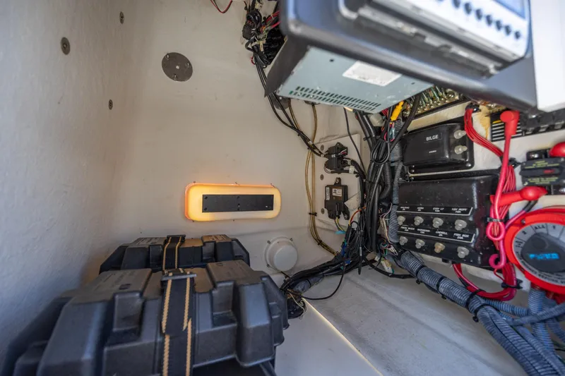 Slide: The Image of Interior view of a 2006 Boston Whaler 210 Outrage boat's electrical wiring and components. - 29