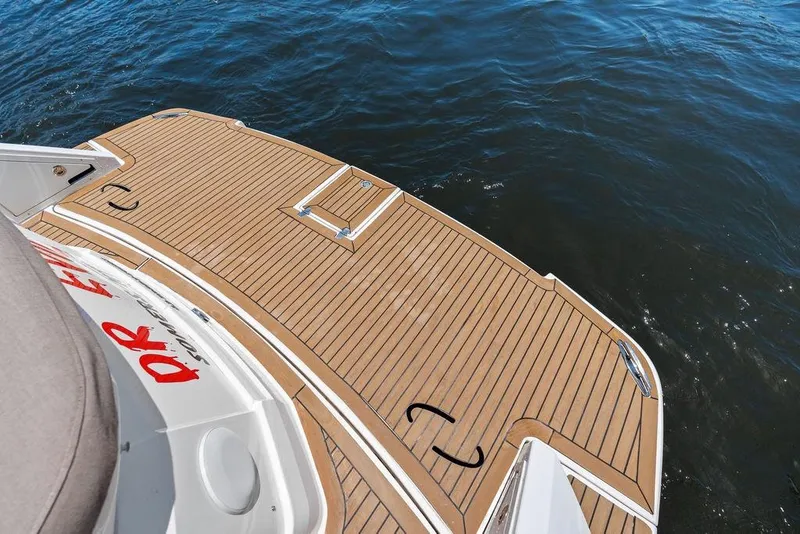 Slide: The Image of 2013 Regal 42 Sport Coupe swim platform on calm water. - 17