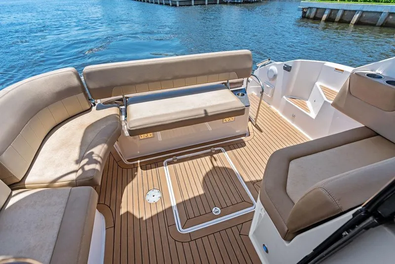 Slide: The Image of Luxurious seating area on a 2013 Regal 42 Sport Coupe yacht with teak flooring. - 18