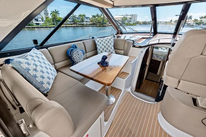 Slide: The Image of Luxurious interior of 2013 Regal 42 Sport Coupe yacht with elegant seating and scenic views. - 22