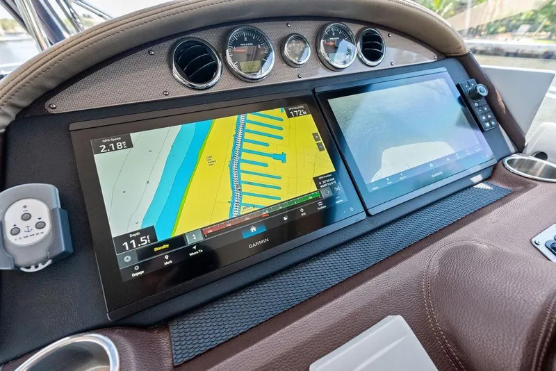 Slide: The Image of Dashboard of 2013 Regal 42 Sport Coupe with Garmin navigation displays. - 28