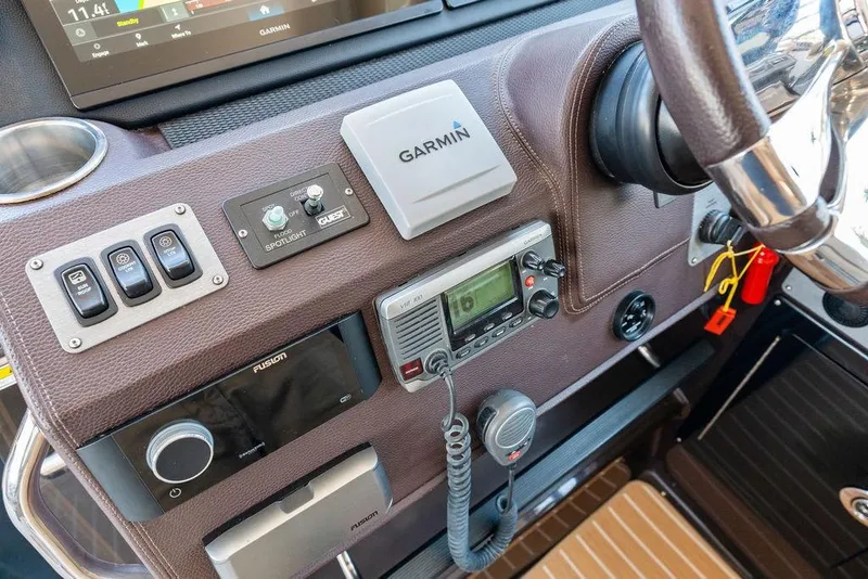 Slide: The Image of Control panel of a 2013 Regal 42 Sport Coupe with Garmin navigation system. - 30