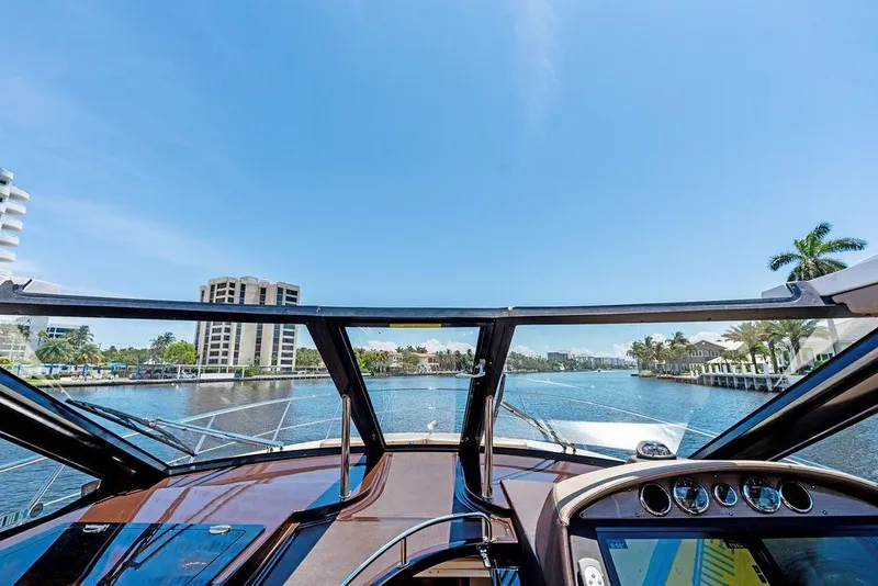 Slide: The Image of Cockpit view from a 2013 Regal 42 Sport Coupe yacht on a sunny day. - 31