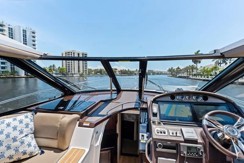Slide: The Image of Interior view of 2013 Regal 42 Sport Coupe yacht cockpit with navigation controls. - 32