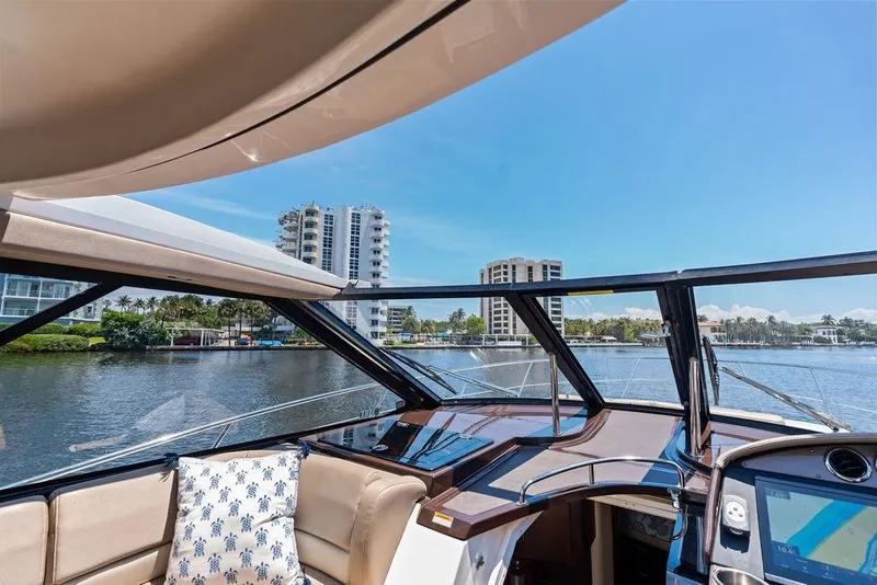 Slide: The Image of Interior view of 2013 Regal 42 Sport Coupe yacht with waterfront cityscape. - 33