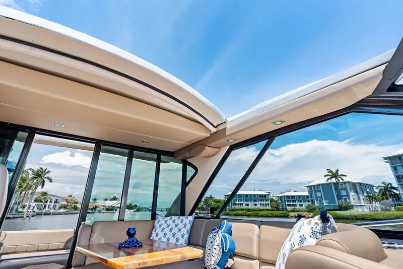 Slide: The Image of Luxurious interior of 2013 Regal 42 Sport Coupe yacht with scenic waterfront view. - 34