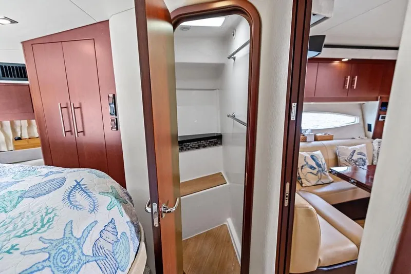 Slide: The Image of Interior of 2013 Regal 42 Sport Coupe with cozy seating and elegant wood finishes. - 36