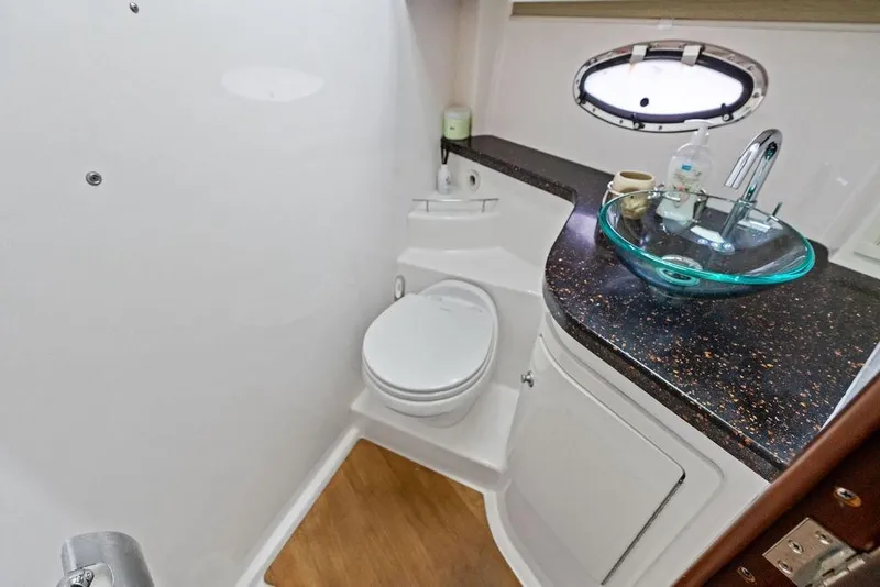 Slide: The Image of Luxurious bathroom in 2013 Regal 42 Sport Coupe yacht with modern glass sink. - 38