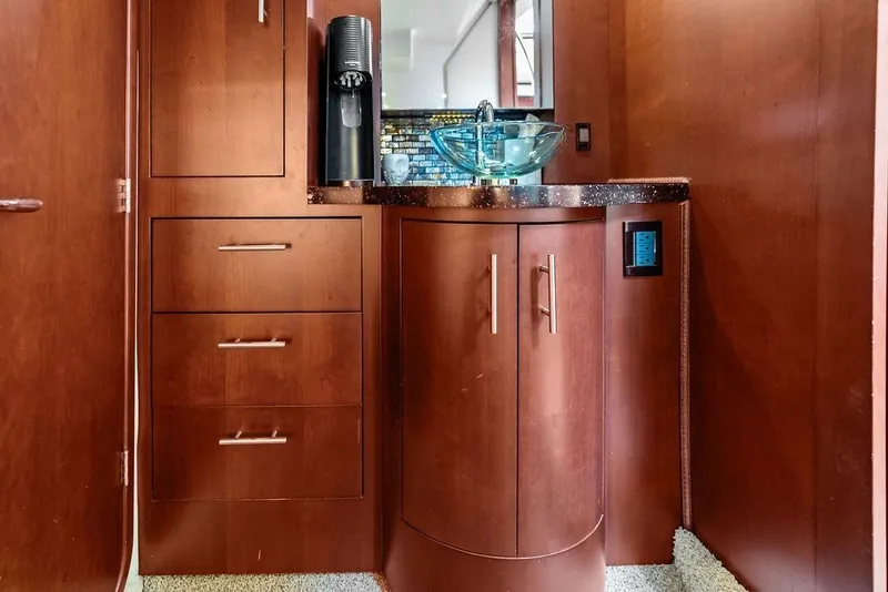 Slide: The Image of Luxurious interior of 2013 Regal 42 Sport Coupe with wooden cabinetry and modern sink. - 44