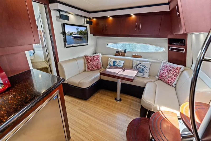 Slide: The Image of Luxurious interior of 2013 Regal 42 Sport Coupe yacht with elegant seating and modern decor. - 46