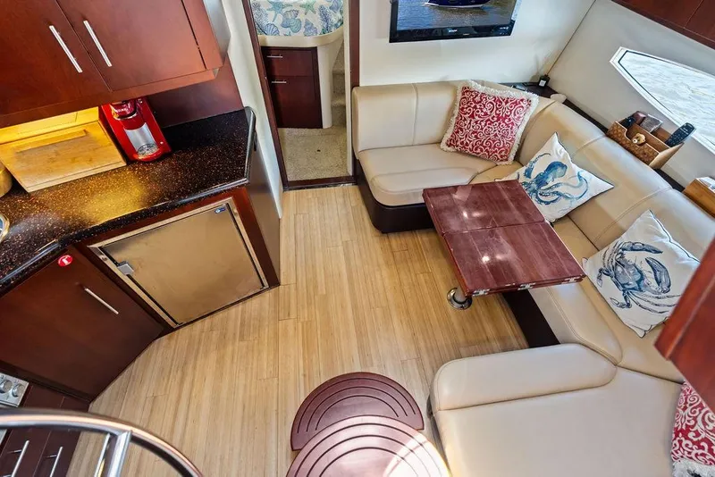 Slide: The Image of Luxurious interior of 2013 Regal 42 Sport Coupe with elegant seating and modern kitchenette. - 47
