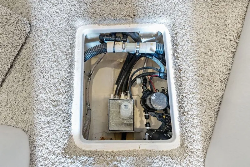 Slide: The Image of Engine compartment of a 2013 Regal 42 Sport Coupe, showcasing mechanical components. - 49