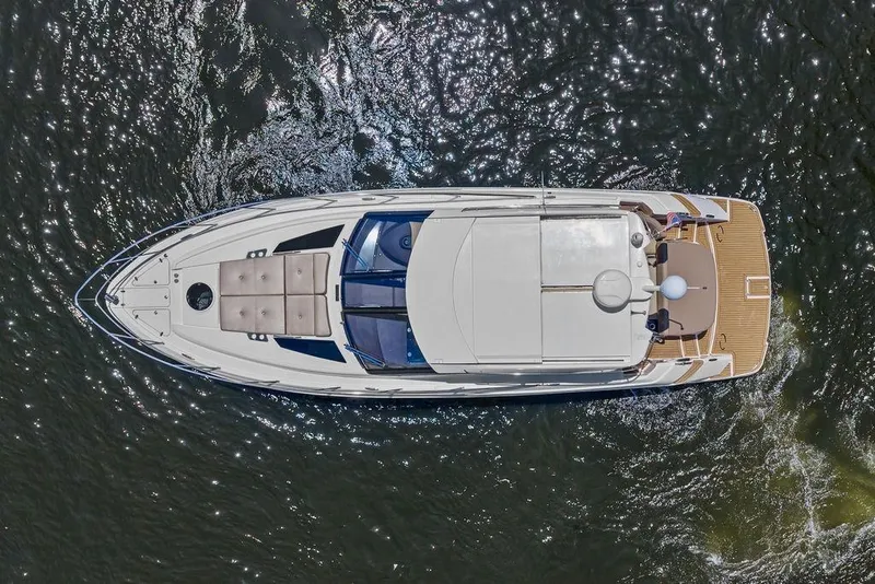 Slide: The Image of Overhead view of a 2013 Regal 42 Sport Coupe yacht on water. - 51