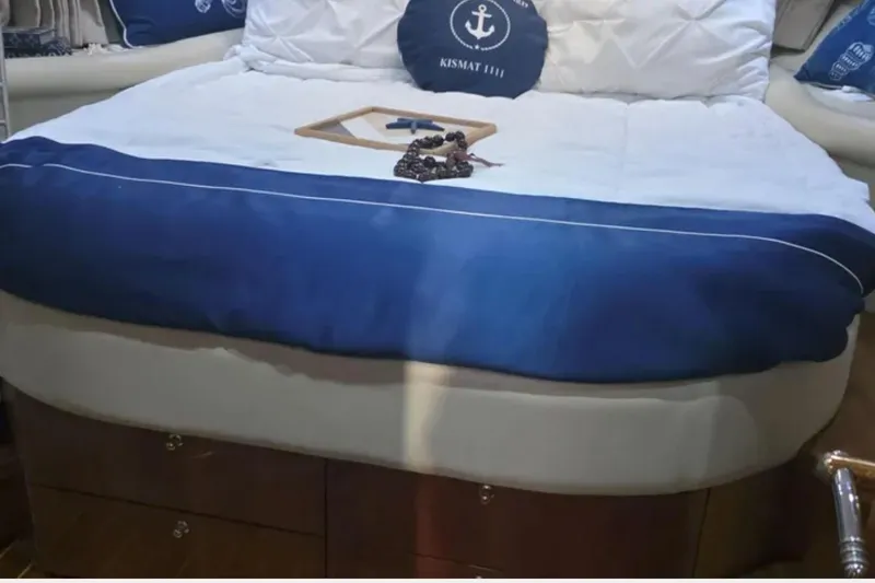 Slide: The Image of Luxurious Sunseeker Camargue 44 yacht bedroom with blue and white bedding, 2001 model. - 12