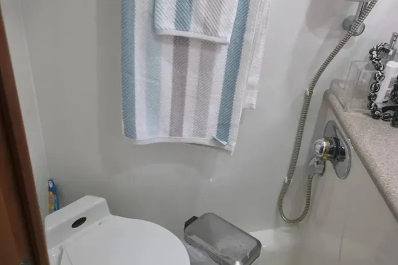 Slide: The Image of Bathroom interior of 2001 Sunseeker Camargue 44 yacht with shower and towel. - 14