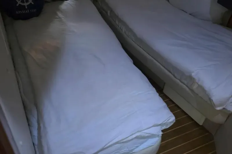 Slide: The Image of Twin beds in the cabin of a 2001 Sunseeker Camargue 44 yacht. - 15