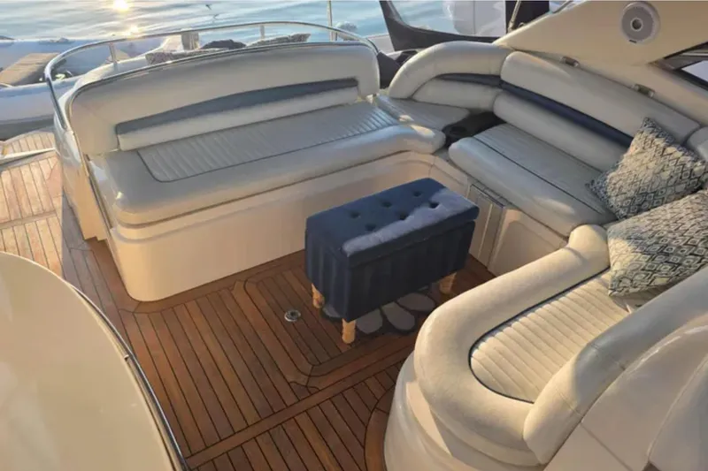 Slide: The Image of Luxurious seating area on a 2001 Sunseeker Camargue 44 yacht with elegant wood flooring. - 5