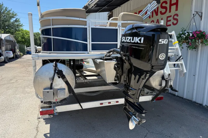 Slide: The Image of 2023 Starcraft LX 18 F pontoon boat with Suzuki 50 horsepower outboard motor. - 21