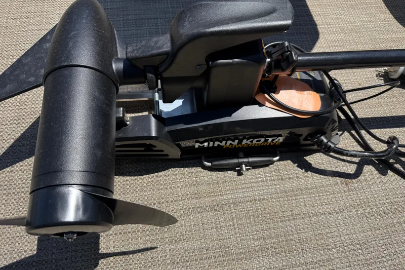 Slide: The Image of Minn Kota PowerDrive motor on 2023 Starcraft LX 18 F boat deck. - 26