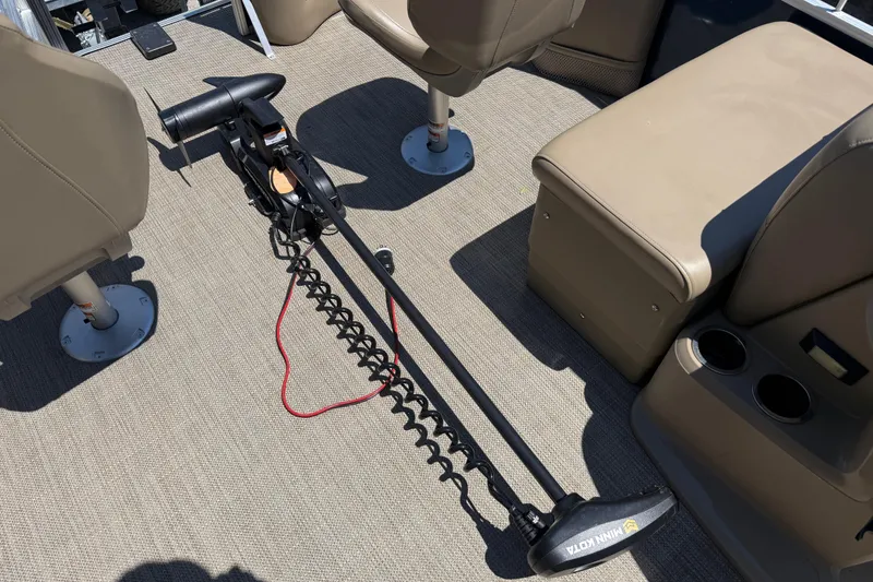 Slide: The Image of 2023 Starcraft LX 18 F boat interior with Minn Kota trolling motor on deck. - 27