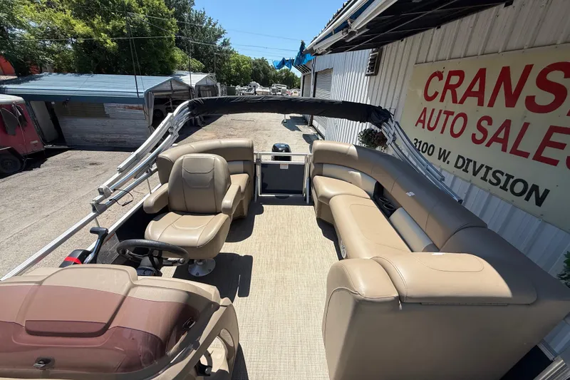 Slide: The Image of 2023 Starcraft LX 18 F pontoon boat with beige seating at Cranston Auto Sales. - 29