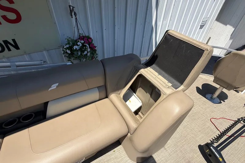 Slide: The Image of 2023 Starcraft LX 18 F boat interior with open storage compartment and seating. - 36