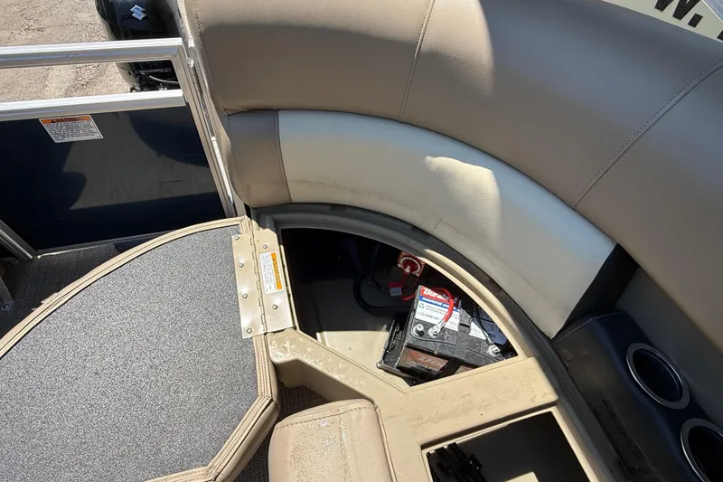Slide: The Image of 2023 Starcraft LX 18 F boat interior with battery compartment and seating area. - 37