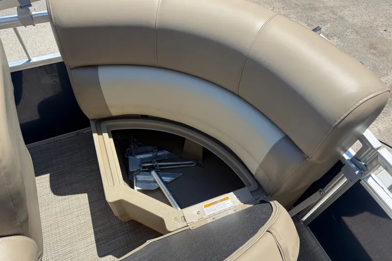 Slide: The Image of 2023 Starcraft LX 18 F boat seat storage with anchor inside. - 39