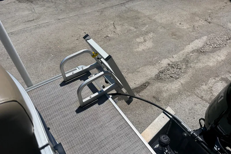 Slide: The Image of 2023 Starcraft LX 18 F boat with foldable ladder on deck. - 42