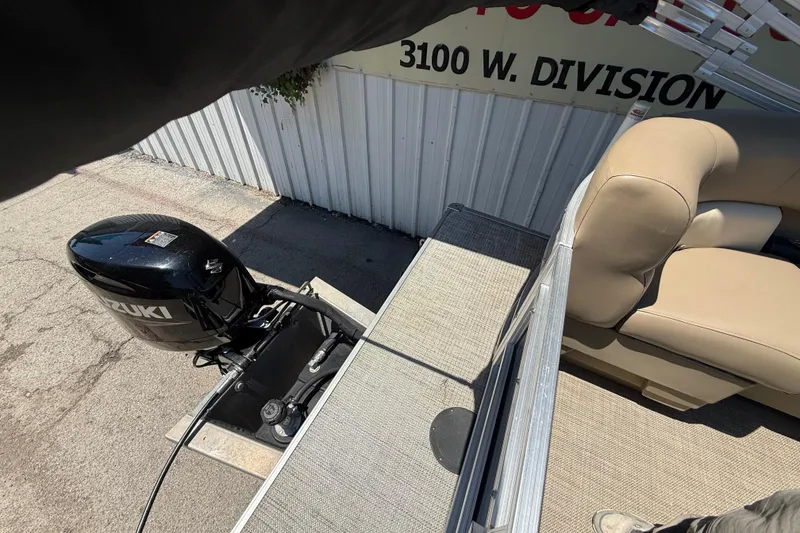 Slide: The Image of 2023 Starcraft LX 18 F boat with Suzuki outboard motor and beige seating. - 43