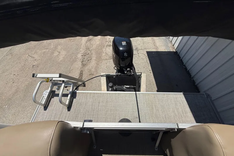 Slide: The Image of 2023 Starcraft LX 18 F boat with motor and ladder, viewed from above. - 44