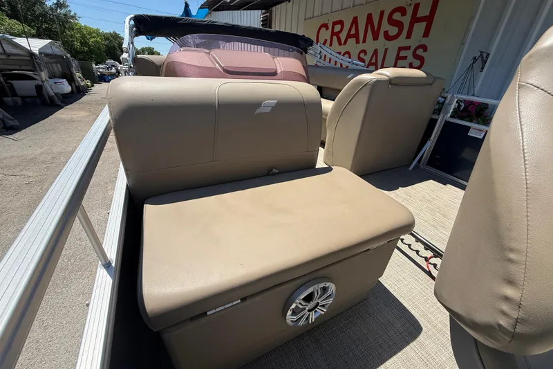 Slide: The Image of 2023 Starcraft LX 18 F boat interior with beige seating and speaker detail. - 45