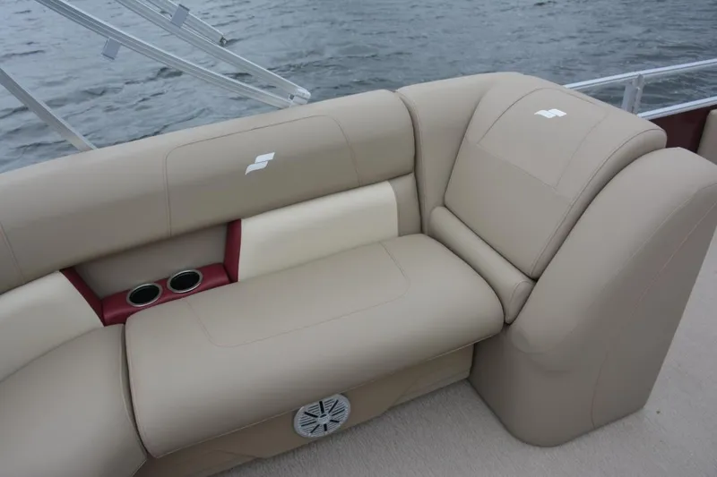 Slide: The Image of Manufacturer Provided Image: 2023 Starcraft LX 18 F boat interior seating with cup holders and speaker. - 8