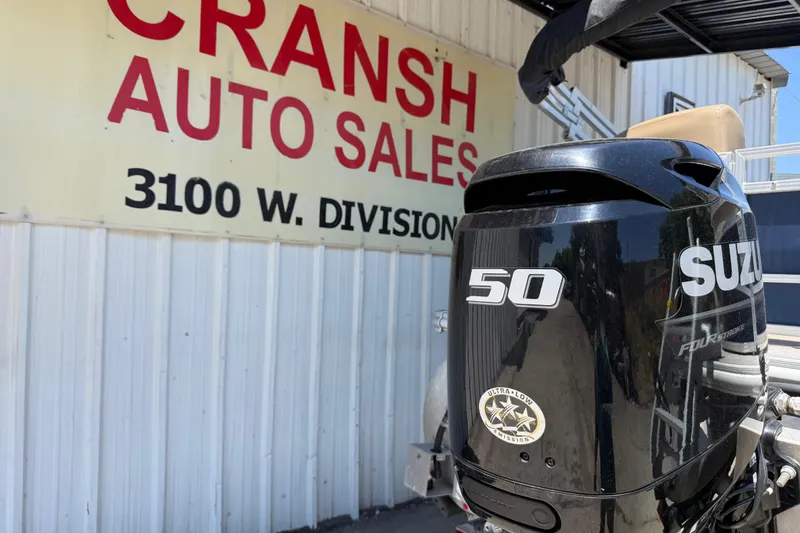 Slide: The Image of Outboard motor on a 2023 Starcraft LX 18 F at Cransh Auto Sales, 3100 W. Division. - 9