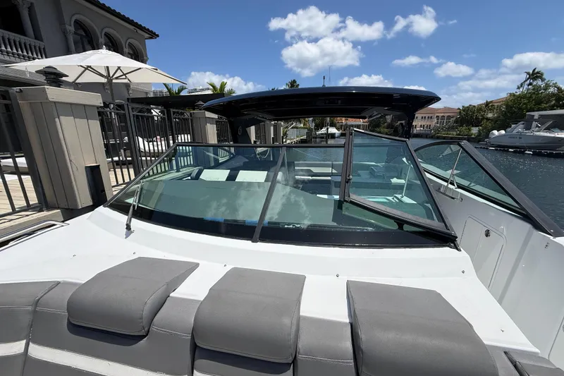 Slide: The Image of 2021 Cruisers Yachts 38 GLS OB docked, showcasing sleek design and spacious seating. - 11