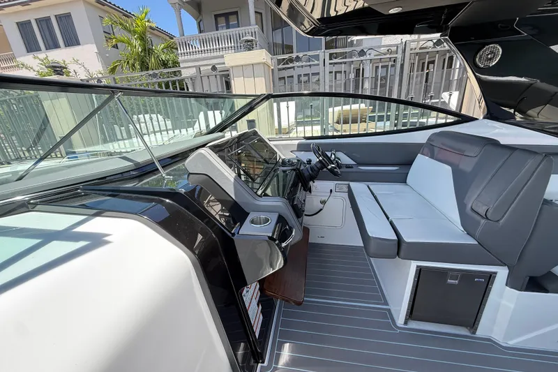 Slide: The Image of 2021 Cruisers Yachts 38 GLS OB cockpit with modern seating and sleek dashboard design. - 15
