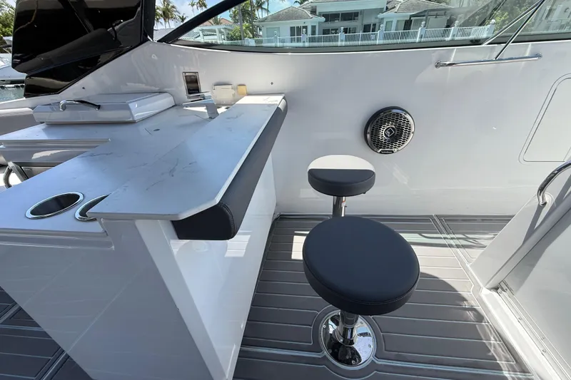 Slide: The Image of Interior of 2021 Cruisers Yachts 38 GLS OB with bar seating and modern design. - 17