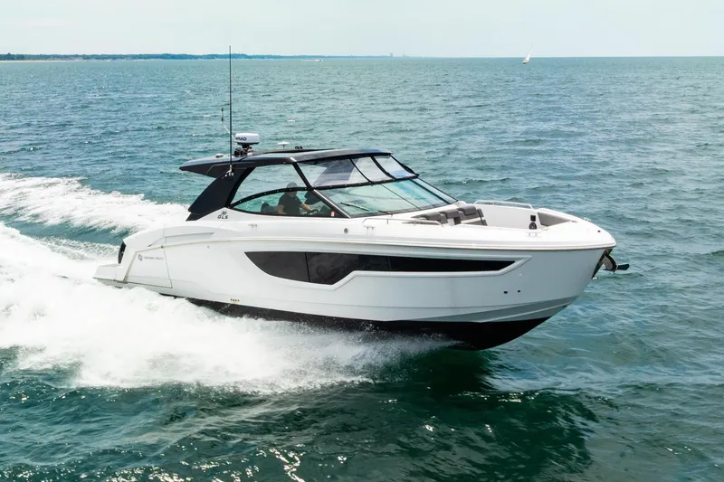 Slide: The Image of 2021 Cruisers Yachts 38 GLS OB speeding on open water. - 2